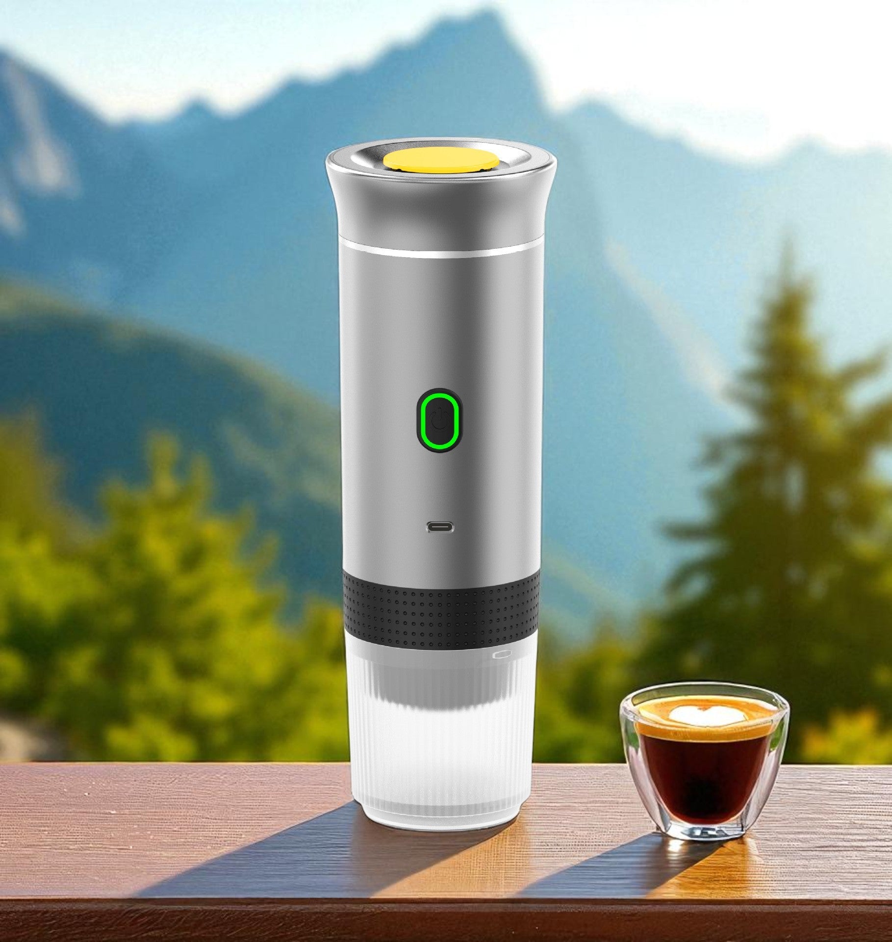 Portable coffee maker with a cup of coffee on a wooden surface with a mountainous background