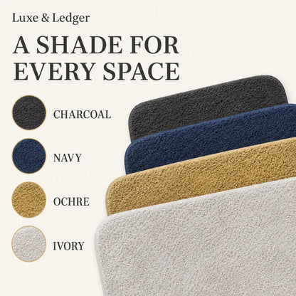 Four textured rectangular mats shown in a diagonal stack on a light beige background, with circular color swatches labeled Charcoal, Navy, Ochre, and Ivory and the headline 'A SHADE FOR EVERY SPACE' and 'Luxe & Ledger'.