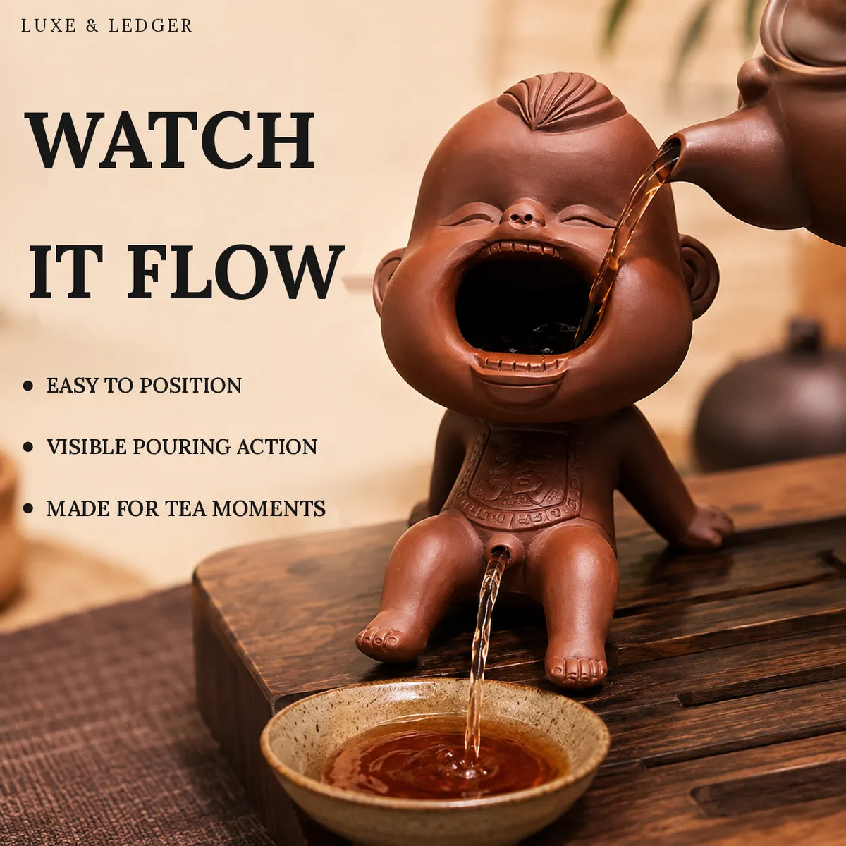 A terracotta-colored ceramic monkey-shaped tea infuser and pour-over vessel shown on a wooden table, with tea being poured into a small bowl and into a teapot at the top right. Large text on the left reads 'WATCH IT FLOW' with bullet points including 'EASY TO POSITION', 'VISIBLE POURING ACTION', and 'MADE FOR TEA MOMENTS'.