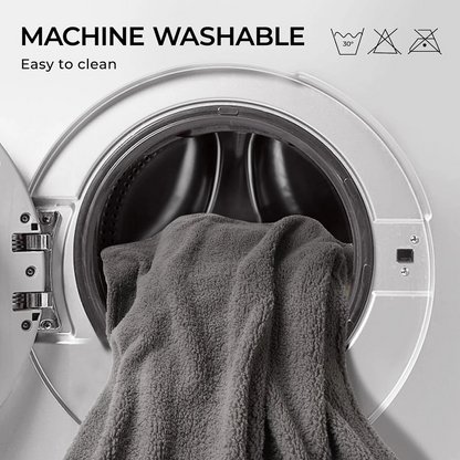 Gray towel inside a washing machine with 'Machine Washable' text and icons.