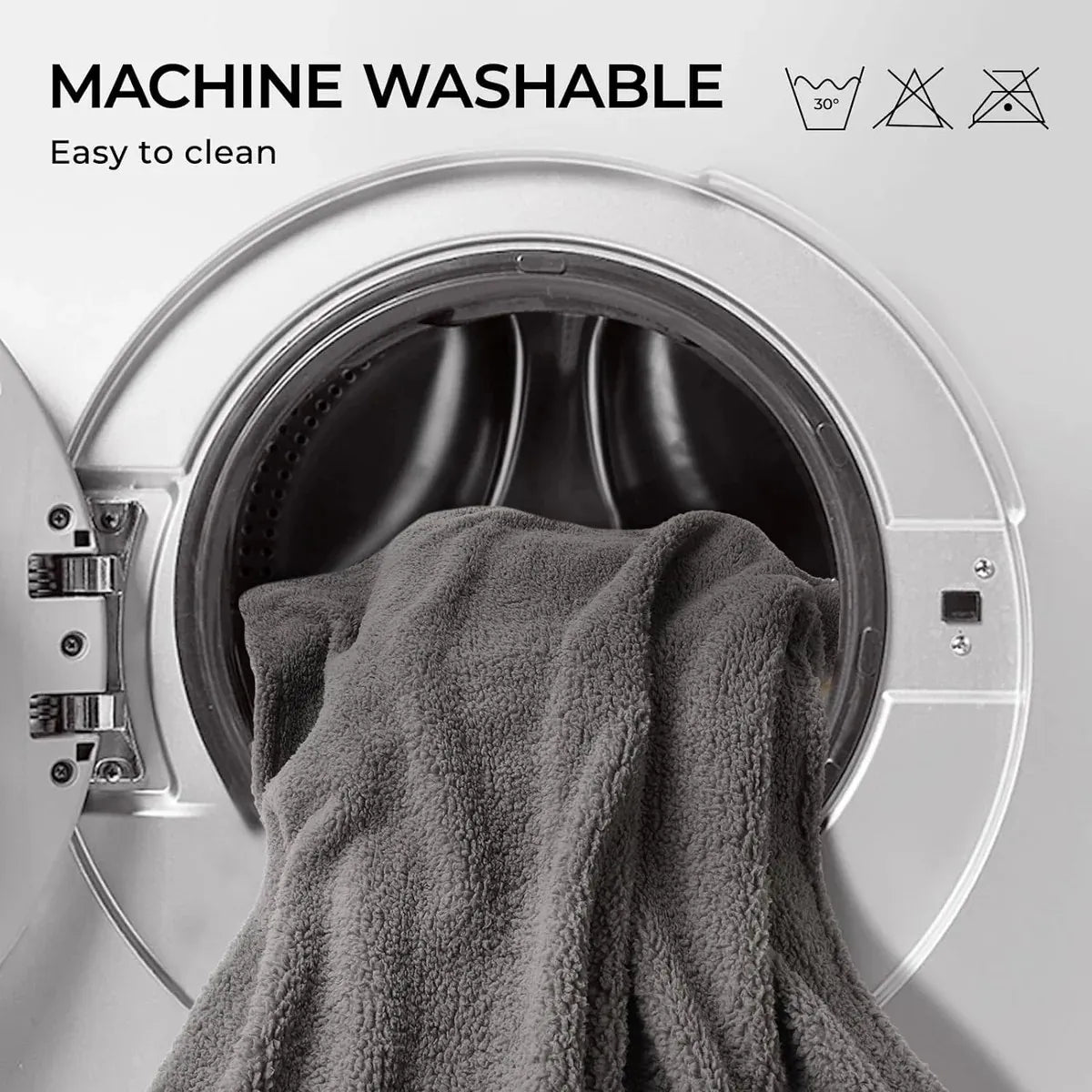 Gray towel inside an open washing machine with 'Machine Washable' text and icons.