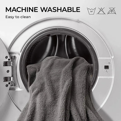 Gray towel inside an open washing machine with 'Machine Washable' text and icons.