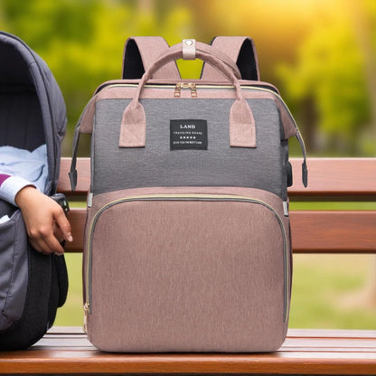 Gray and brown backpack on a wooden bench with a blurred natural background