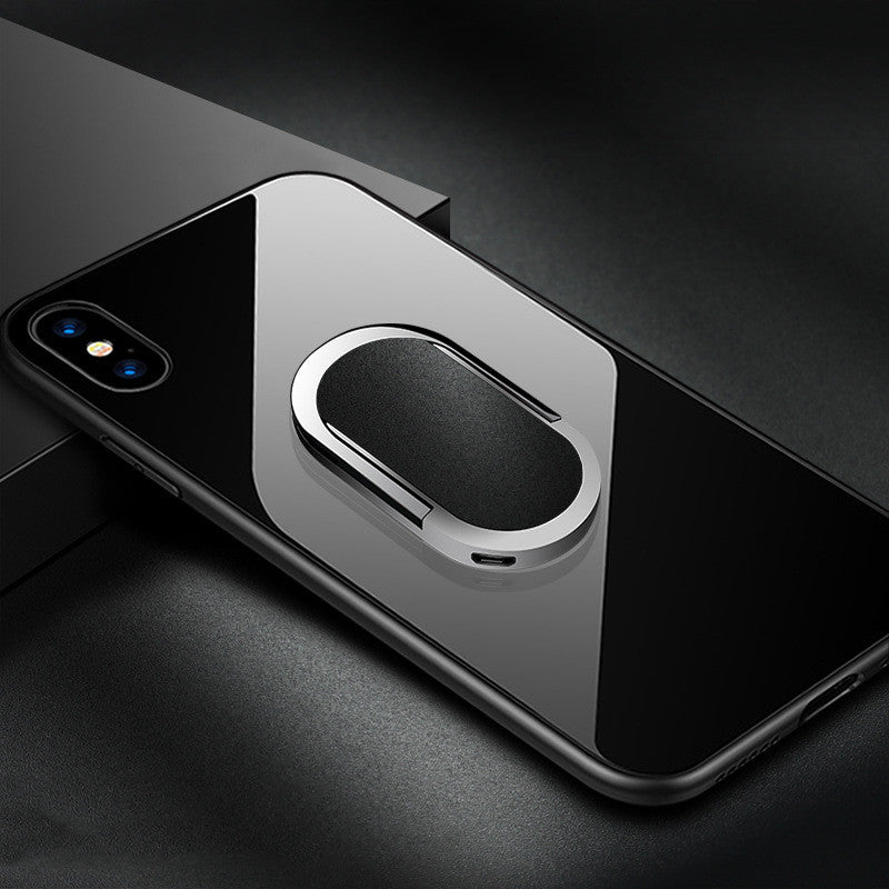 Phone case with a metallic ring holder on a black smartphone