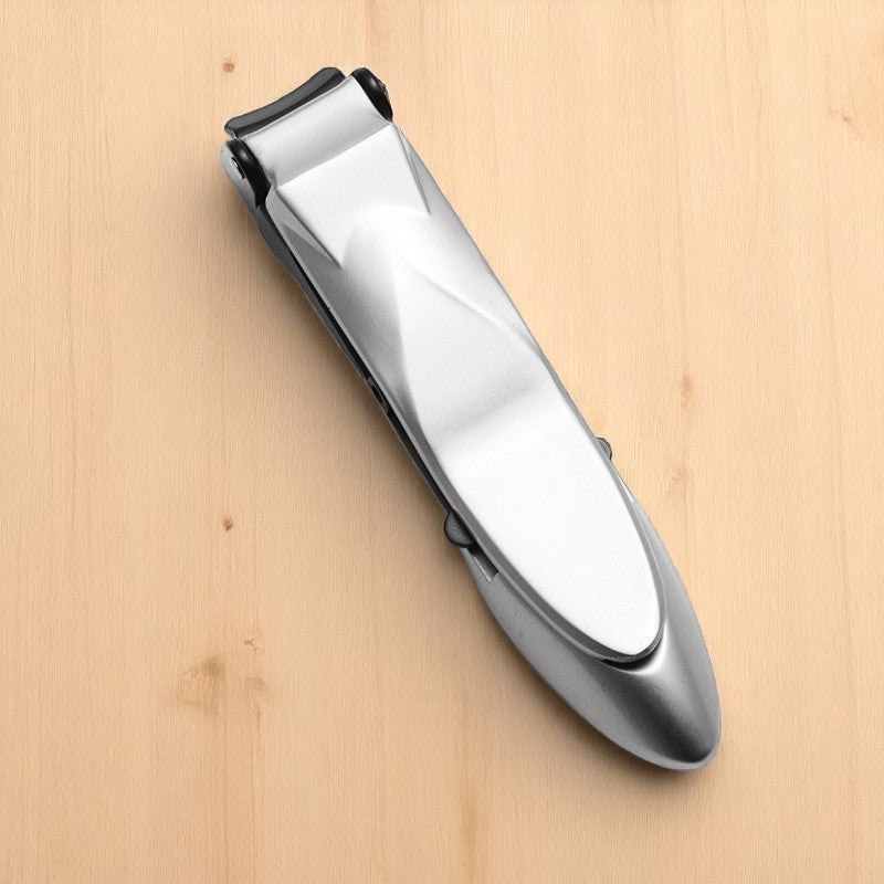 Silver nail clipper on a wooden surface