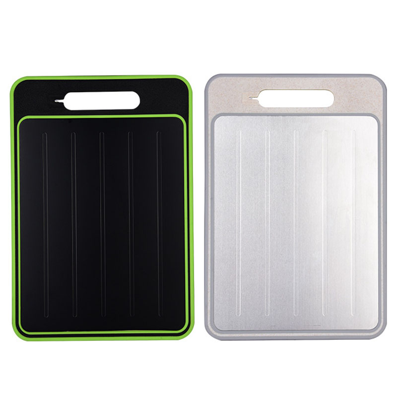 Two rectangular cutting boards, one black with green trim and one silver, on a white background.