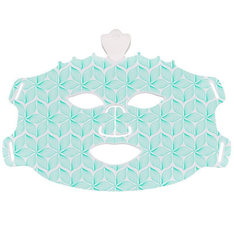 Teal and white geometric-patterned face mask on a white background
