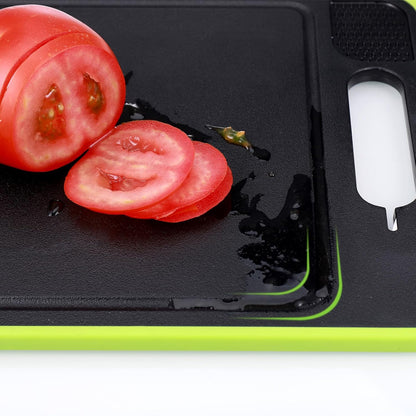 Sliced tomatoes on a black cutting board with a green edge
