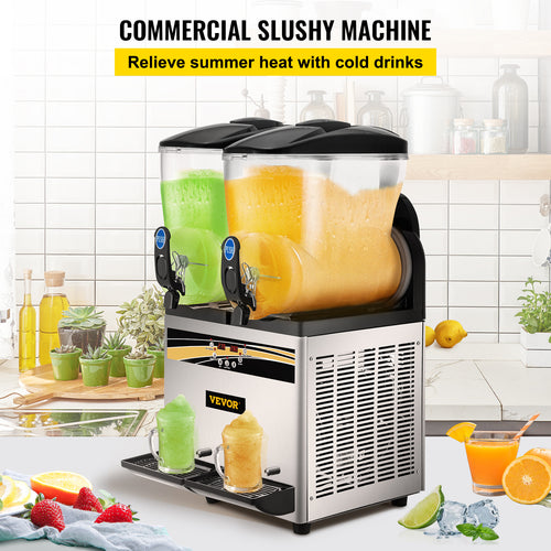 A commercial slushy machine with two containers filled with yellow and green slushy. The machine is placed on a kitchen counter with fruits and other ingredients around it.