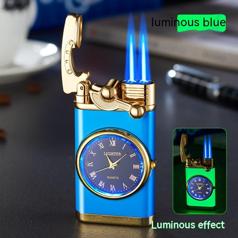 Blue and gold lighter with clock face, glowing blue flames on a dark surface.