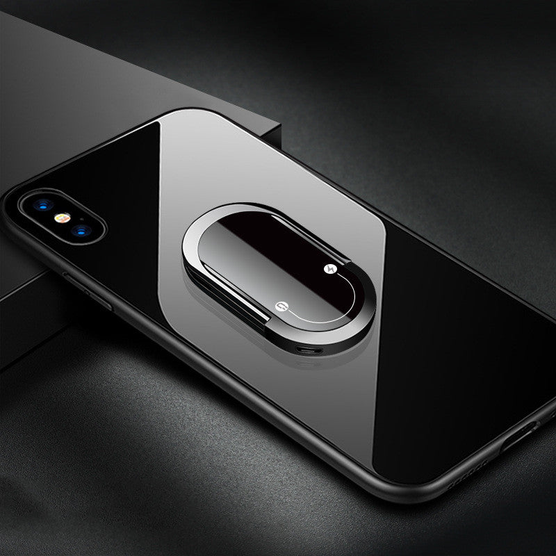 Phone case with a metallic ring holder on a dark surface