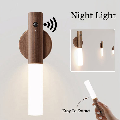 Wooden wall-mounted night light with a hand holding a remote control on a light gray background