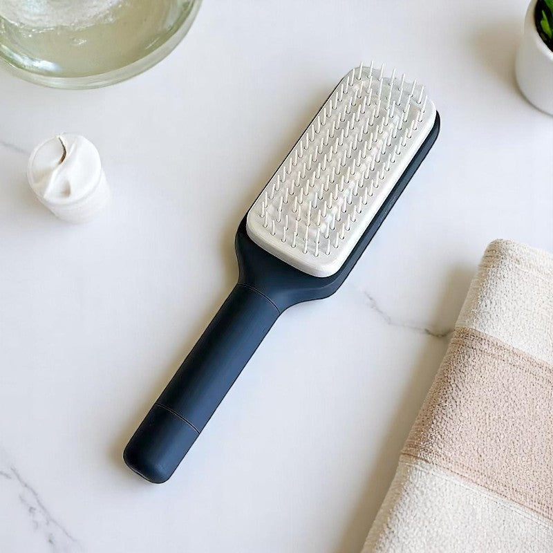 Two self-cleaning hair brushes in black and purple colors, with an additional inset showing the brush's bristles.