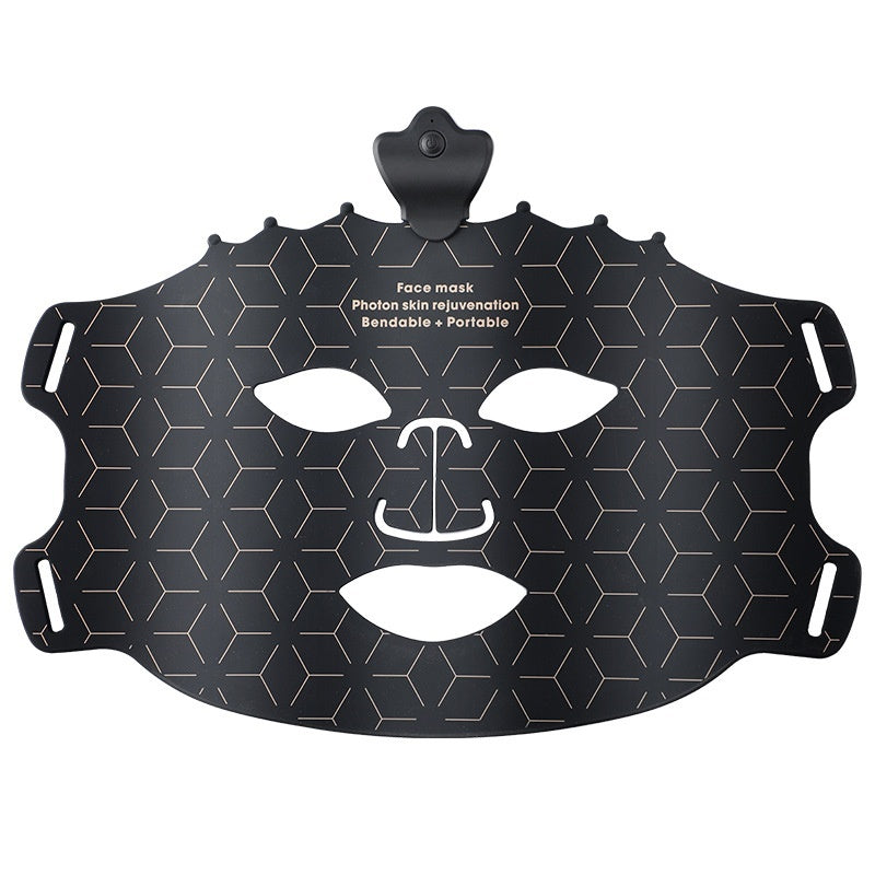 Black face mask with white facial features on a white background