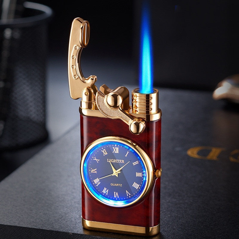 Decorative lighter with clock face and blue flame on a dark surface