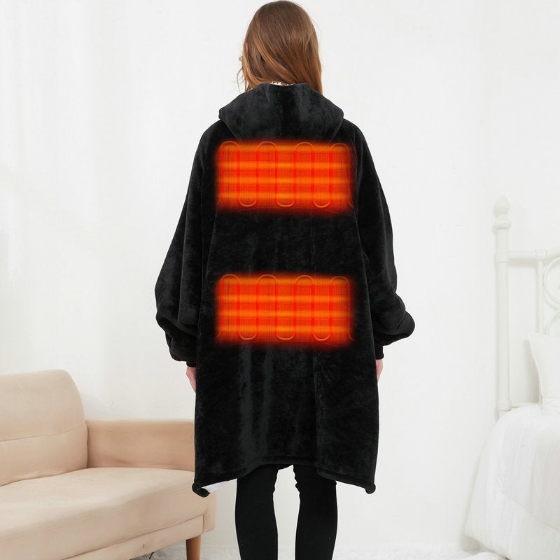 Person wearing a black heated blanket with glowing red heating elements on a white background.