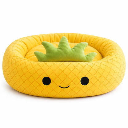 A yellow pineapple-shaped plush pet bed with a quilted texture, embroidered black face, and a green crown-shaped pillow inside, shown on a white background.