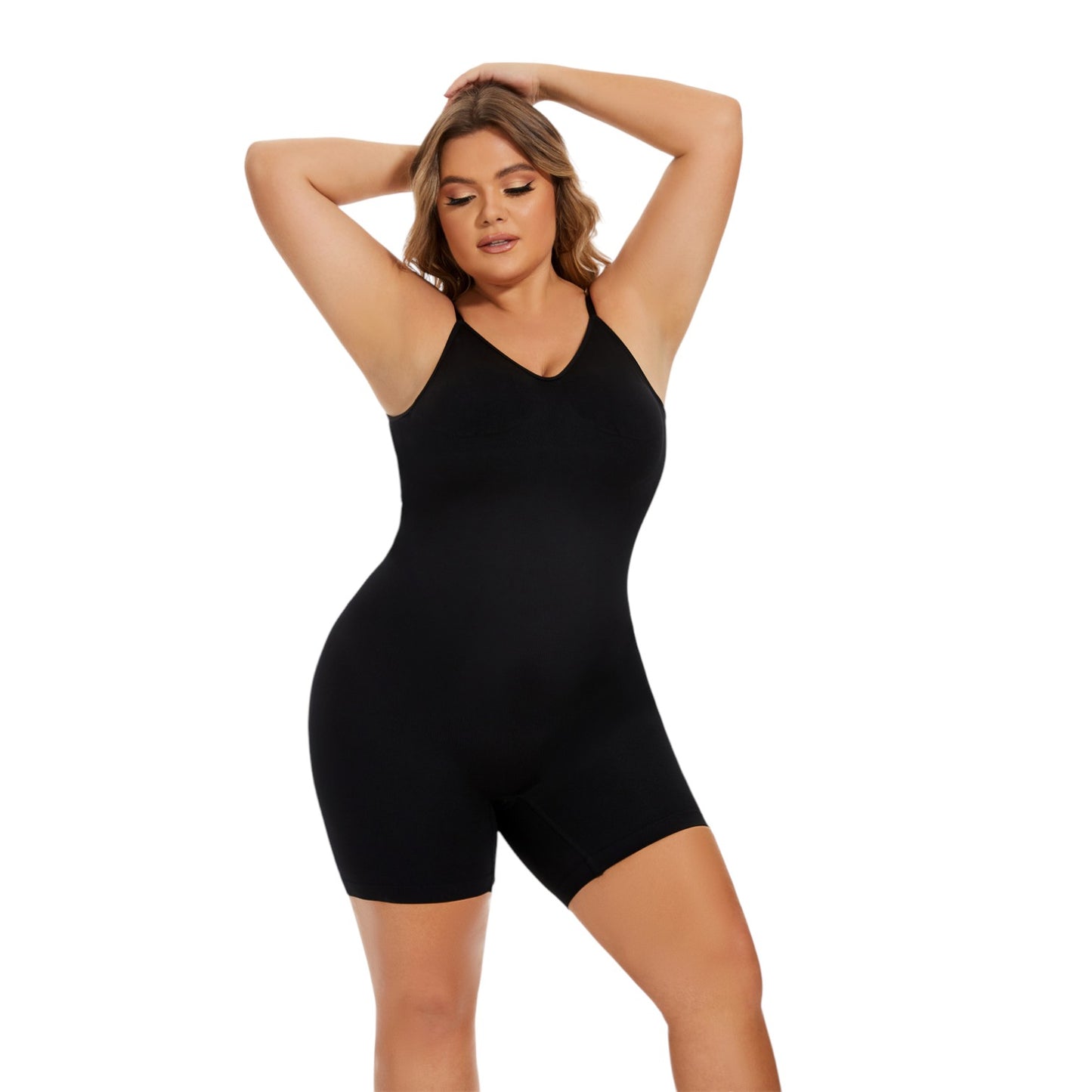 Woman wearing a black bodysuit against a white background