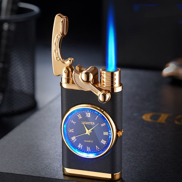 Gold and black lighter with clock face and blue flame on a dark surface