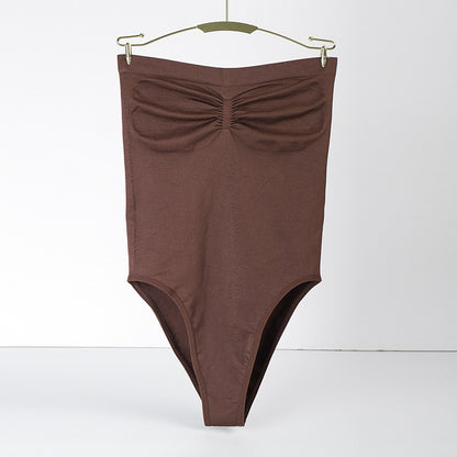 Brown swimsuit with a bow detail on a white background