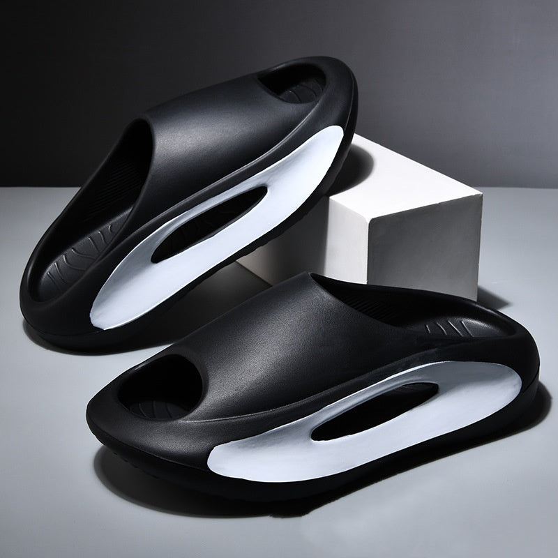 A single black and white summer slide with a sleek resistant design, placed against a patterned background with text highlighting 'GREAT GRIP FOR ANY SCENARIO' and 'SLICK RESISTANT DESIGN'.