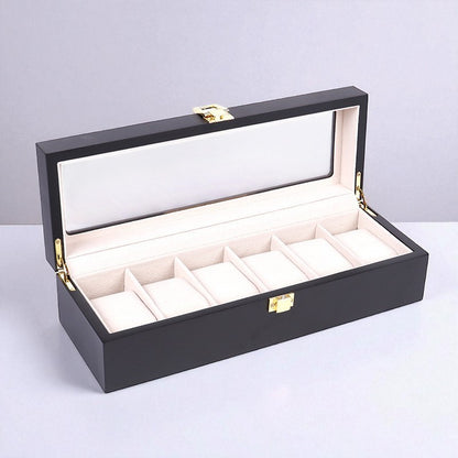 Luxury black watch box with six watches displayed on a light gray background