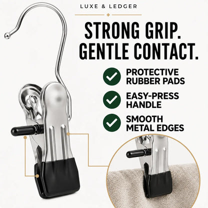 A metal fabric clip with a curved hook, black rubber pad, and black lever, shown on a light background with marketing text and a circular inset demonstrating use on fabric.