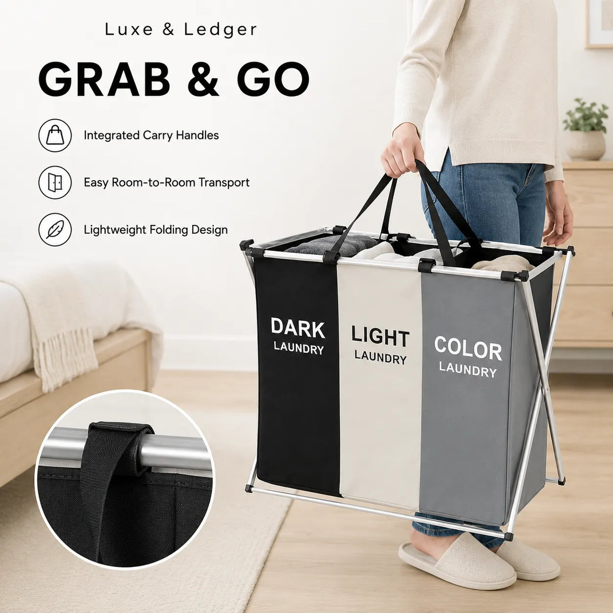 A person carries a large three-compartment laundry hamper in a bright room. The hamper has black, white, and gray fabric panels with white text reading 'DARK LAUNDRY', 'LIGHT LAUNDRY', and 'COLOR LAUNDRY'.