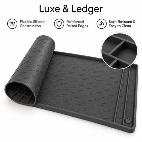 A dark gray flexible silicone mat shown partially unrolled on a white background, with text reading 'Luxe & Ledger' and feature icons for flexible silicone construction, reinforced raised edges, and stain-resistant easy-to-clean design. A circular inset shows a close-up of the raised grid pattern.