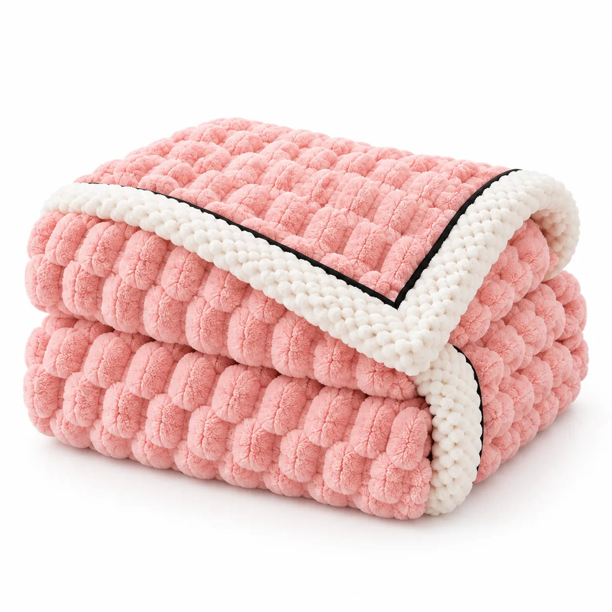 A folded pink textured blanket with a chunky bubble pattern and a cream-colored border with a thin black edge, shown on a clean white background.