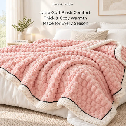 A pink textured plush throw blanket with cream borders and black piping draped over a bed in a bright, modern bedroom. Text at the top reads 'Luxe & Ledger' and 'Ultra-Soft Plush Comfort Thick & Cozy Warmth Made for Every Season'.