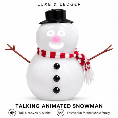 Luxe & Ledger talking animated snowman toy on a white background, featuring a black top hat, red and white striped scarf, twig arms, and a smiling face.