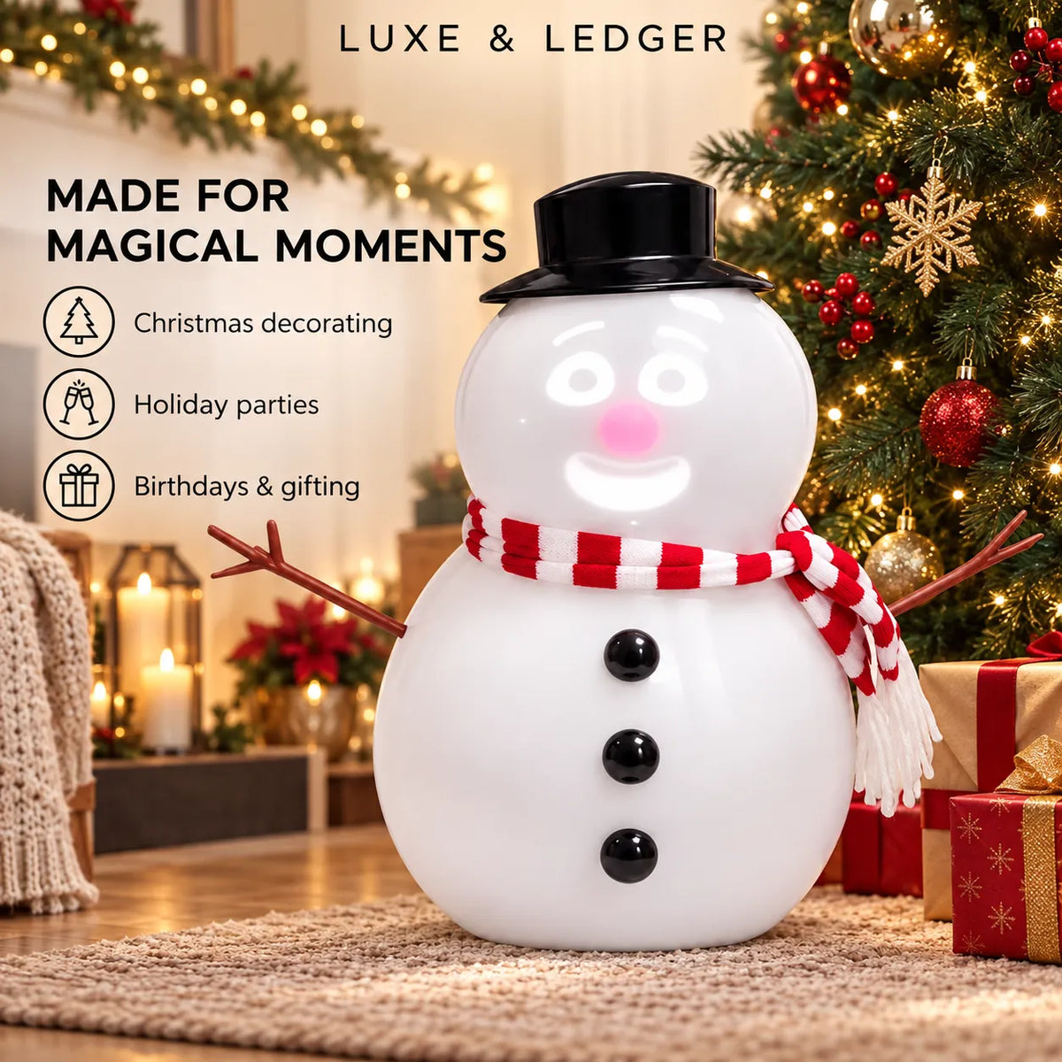 A white snowman-shaped decorative light with a black top hat, red-and-white striped scarf, and twig arms, shown in a festive holiday setting with a Christmas tree, candles, and wrapped gifts. Text on the image reads 'LUXE & LEDGER' and 'MADE FOR MAGICAL MOMENTS' with holiday use icons.