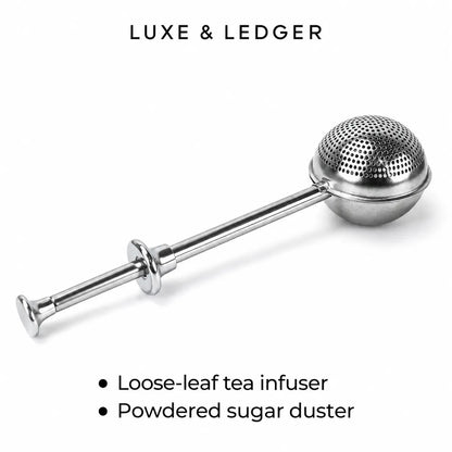 A stainless steel loose-leaf tea infuser with a spherical perforated head and long handle, shown on a white background with the text 'LUXE & LEDGER' at the top and bullet points at the bottom.