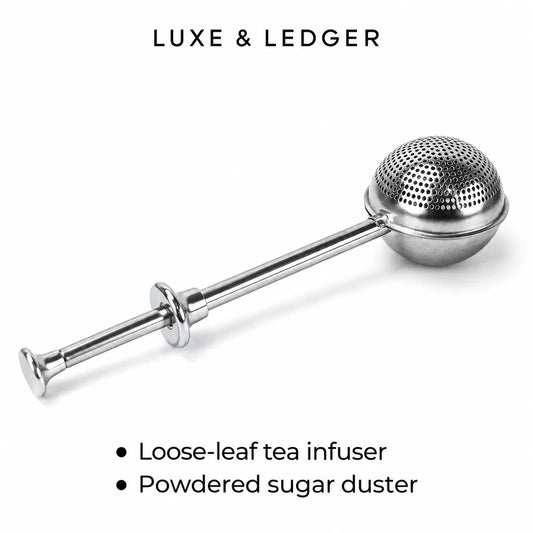 A stainless steel loose-leaf tea infuser with a spherical perforated head and long handle, shown on a white background with the text 'LUXE & LEDGER' at the top and bullet points at the bottom.