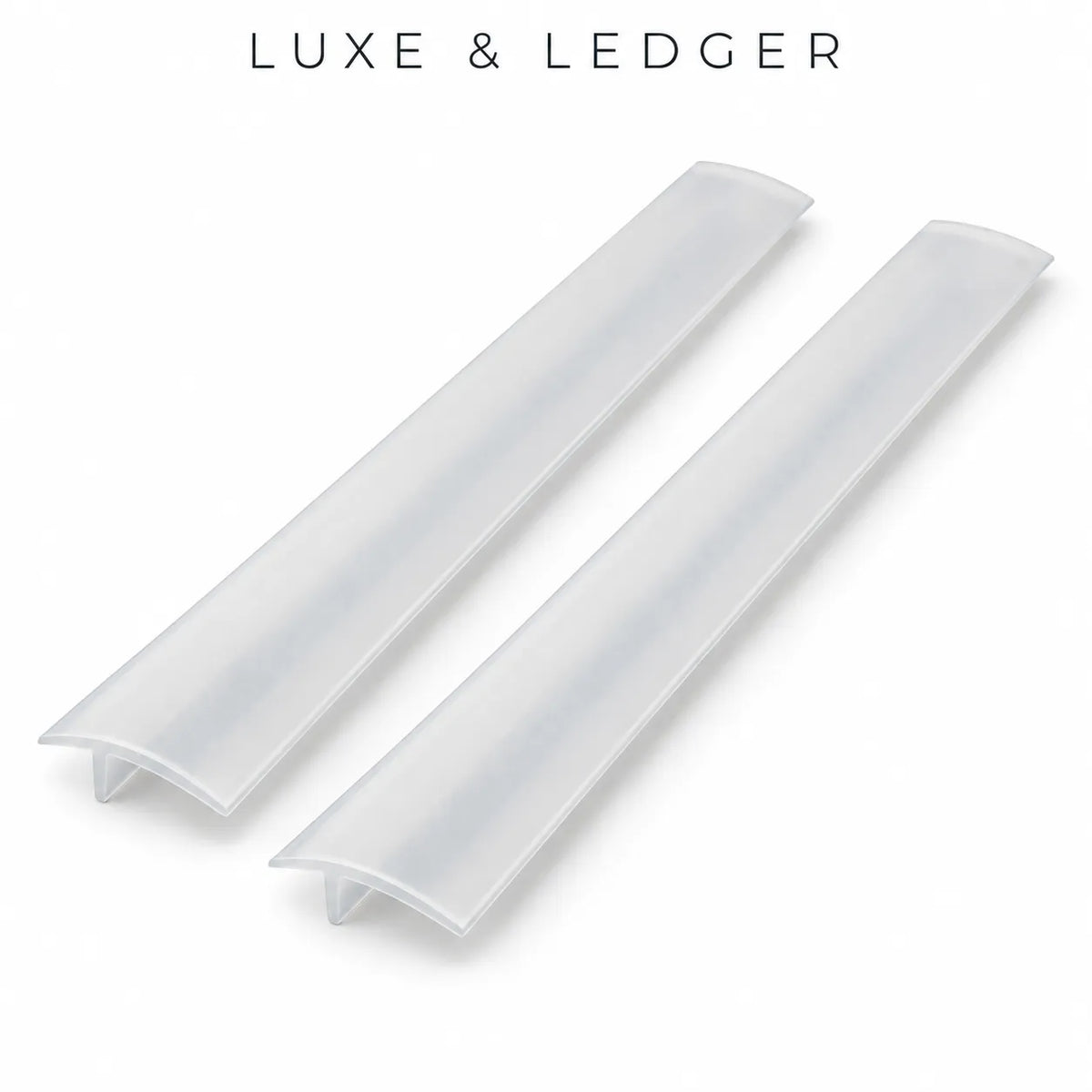 Two translucent white acrylic or PVC ledger channel profiles shown on a clean white background, with the text 'LUXE & LEDGER' printed above.
