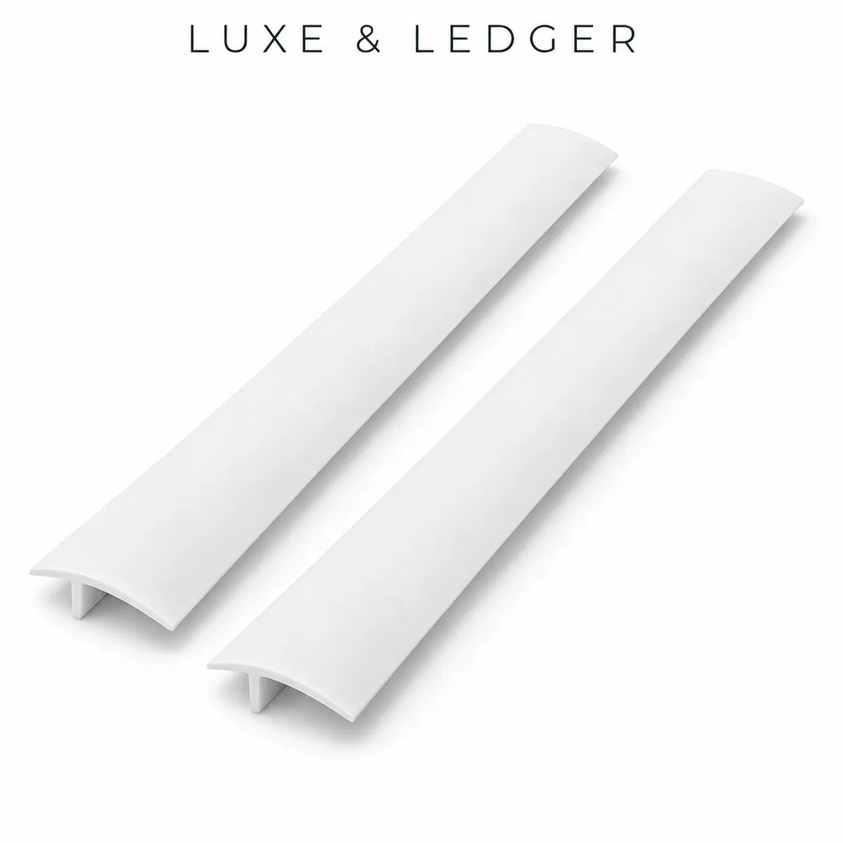 Two white curved drawer pull handles shown on a clean white background with the text 'LUXE & LEDGER' at the top.