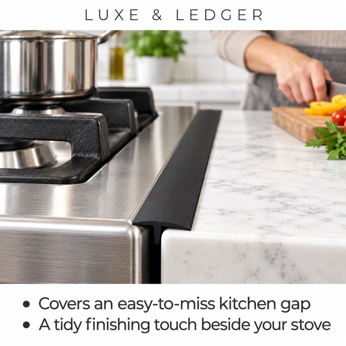 A black kitchen countertop ledge trim piece shown installed beside a stainless steel gas stove in a real kitchen setting, with a person's hand visible in the background preparing food. Text at the top reads 'LUXE & LEDGER' and bullet points mention covering a kitchen gap and providing a tidy finishing touch.