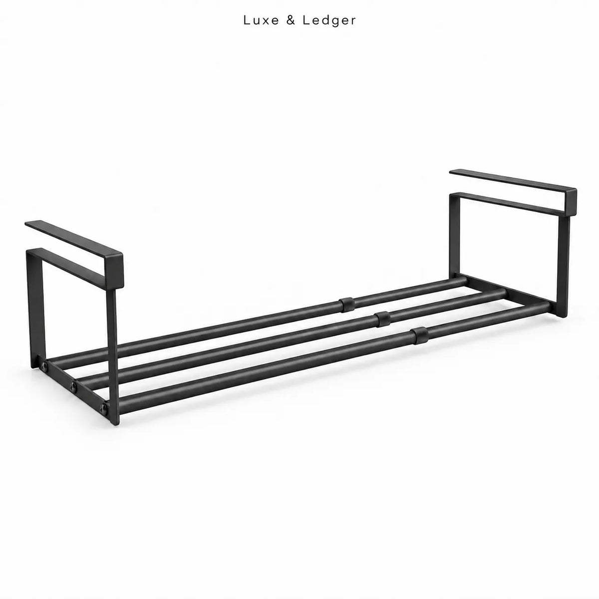 A black metal towel bar set with a minimalist rectangular frame design, shown on a clean white background with 'Luxe & Ledger' text at the top.