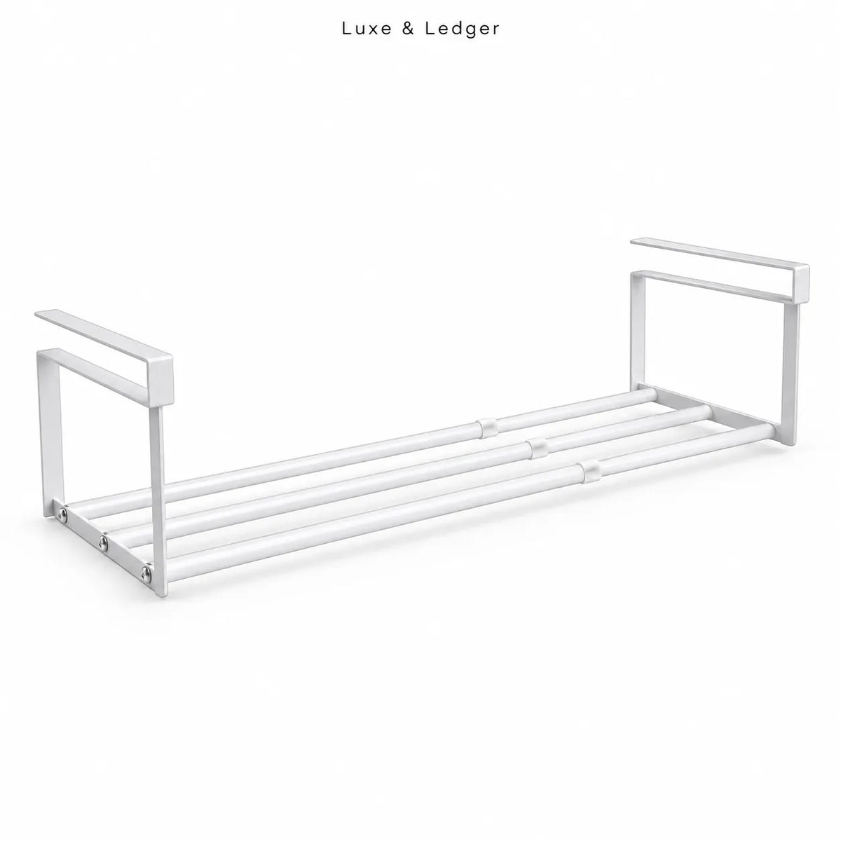 A modern white metal towel bar shelf with a minimalist design, featuring a double-bar rack and integrated side handles, shown on a clean white background with 'Luxe & Ledger' text at the top.