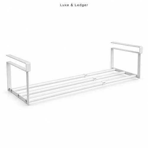 A modern white metal towel bar shelf with a minimalist design, featuring a double-bar rack and integrated side handles, shown on a clean white background with 'Luxe & Ledger' text at the top.
