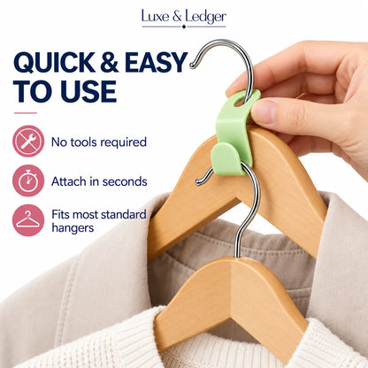 A hand uses a light green plastic hanger hook accessory to hang a wooden hanger with a cream sweater on a white background, with Luxe & Ledger branding and feature callouts on the left.