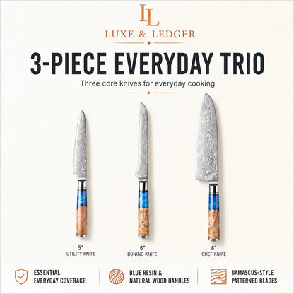 Luxe & Ledger 3-piece everyday cooking knife set on a light cream background, featuring a 5-inch utility knife, 6-inch boning knife, and 8-inch chef knife with patterned Damascus steel blades and blue resin handles.