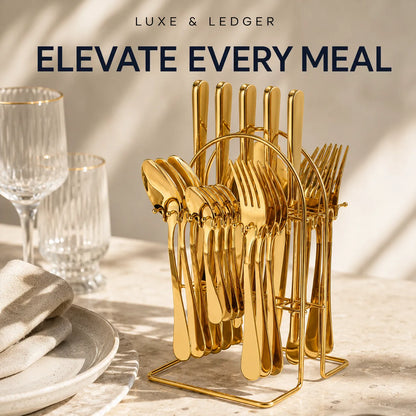 Gold-tone cutlery set displayed in a matching stand on a styled dining table, with wine glasses, plates, and folded napkins in soft sunlight. Text at the top reads 'LUXE & LEDGER' and 'ELEVATE EVERY MEAL'.