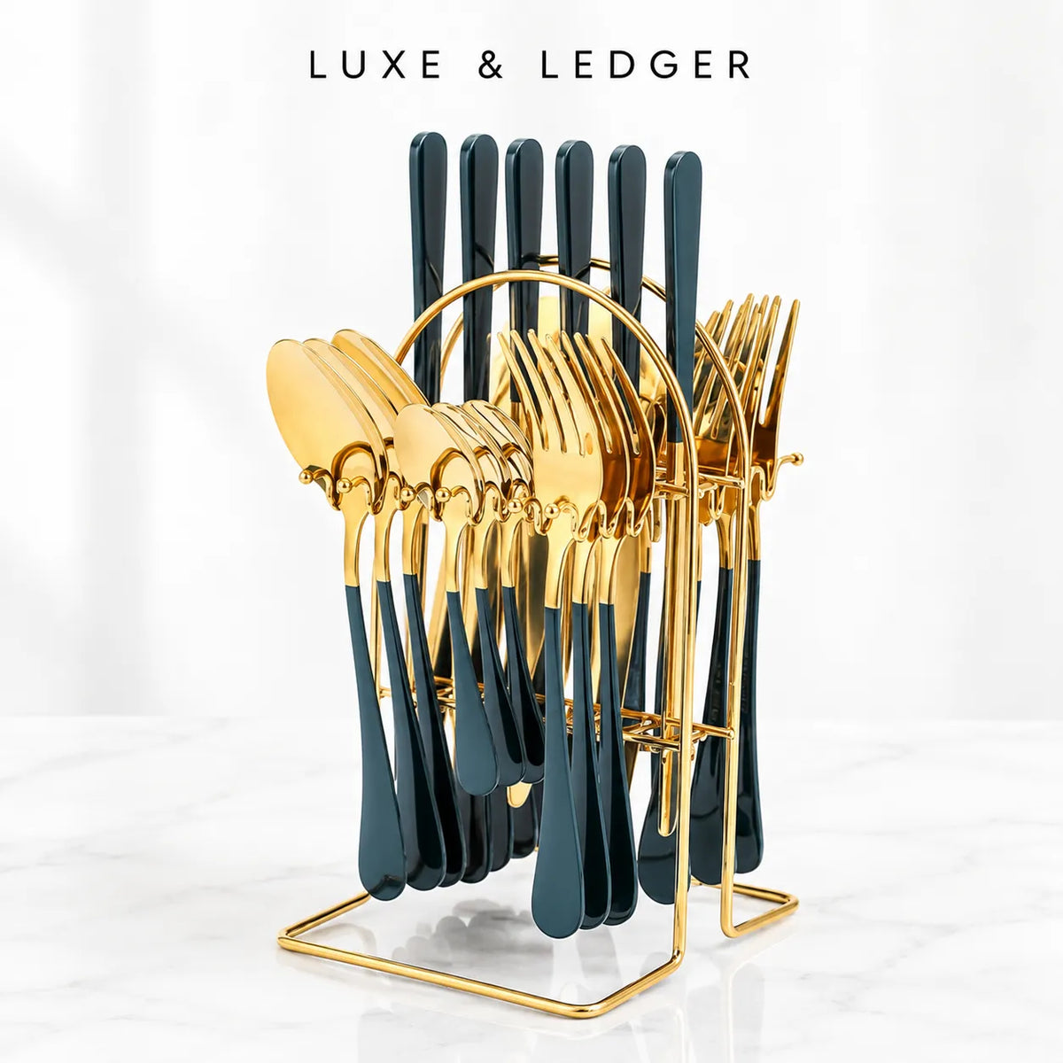 A luxury cutlery set with gold-tone and dark teal handles, displayed on a gold stand against a clean white marble background with the text 'LUXE & LEDGER' at the top.