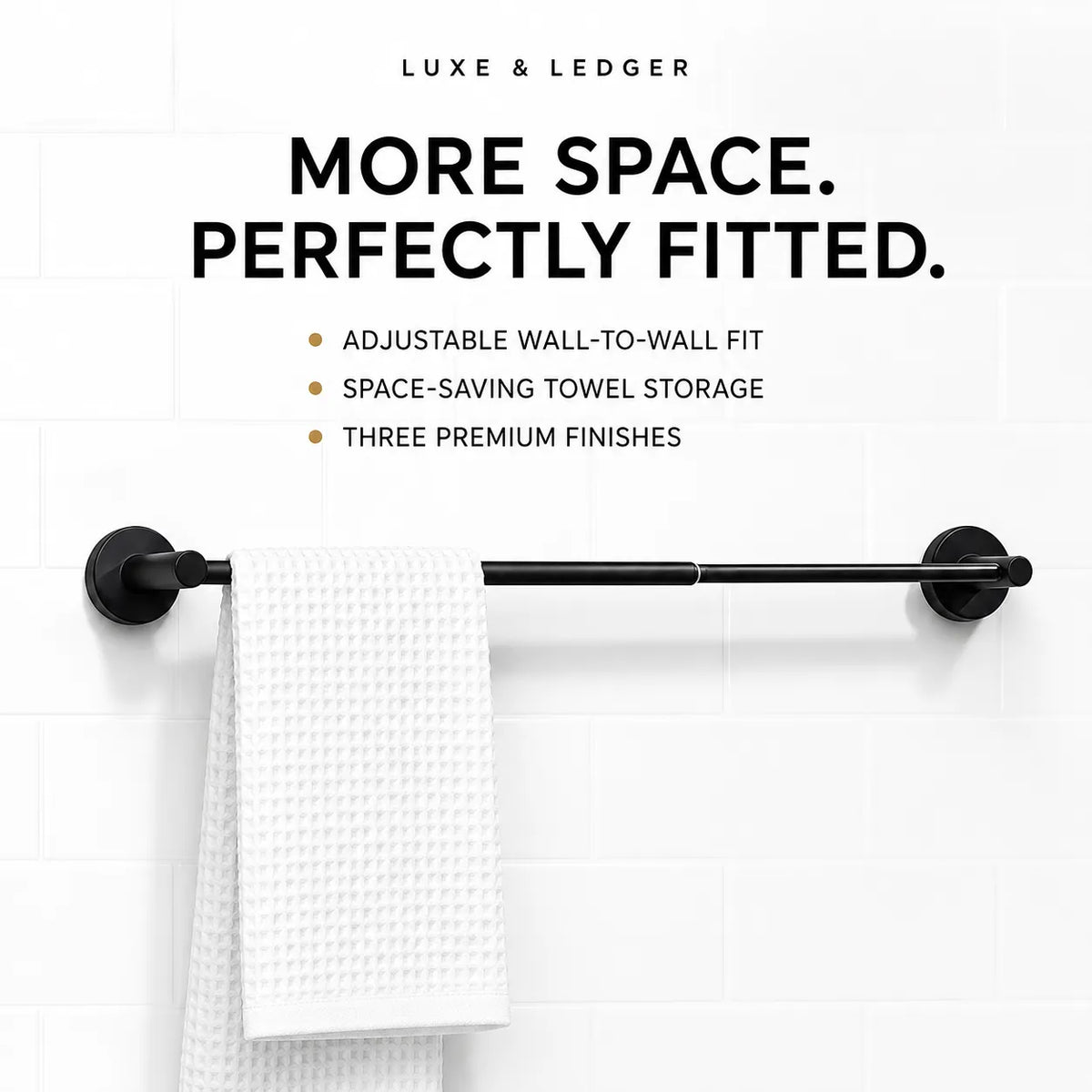 Black towel bar mounted on a white tiled wall, with a white textured towel hanging from the center. Text above reads 'LUXE & LEDGER' and 'MORE SPACE.