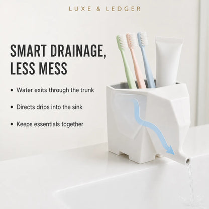 A white geometric toothbrush holder with a spout, shown on a bathroom counter with toothbrushes and a toothpaste tube. The image includes marketing text and a blue arrow graphic illustrating smart drainage.