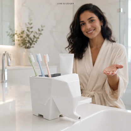 A woman in a cream robe stands in a bright bathroom behind a white geometric toothbrush holder containing toothbrushes and a tube of toothpaste. The text 'LUXE & LEDGER' is visible at the top.