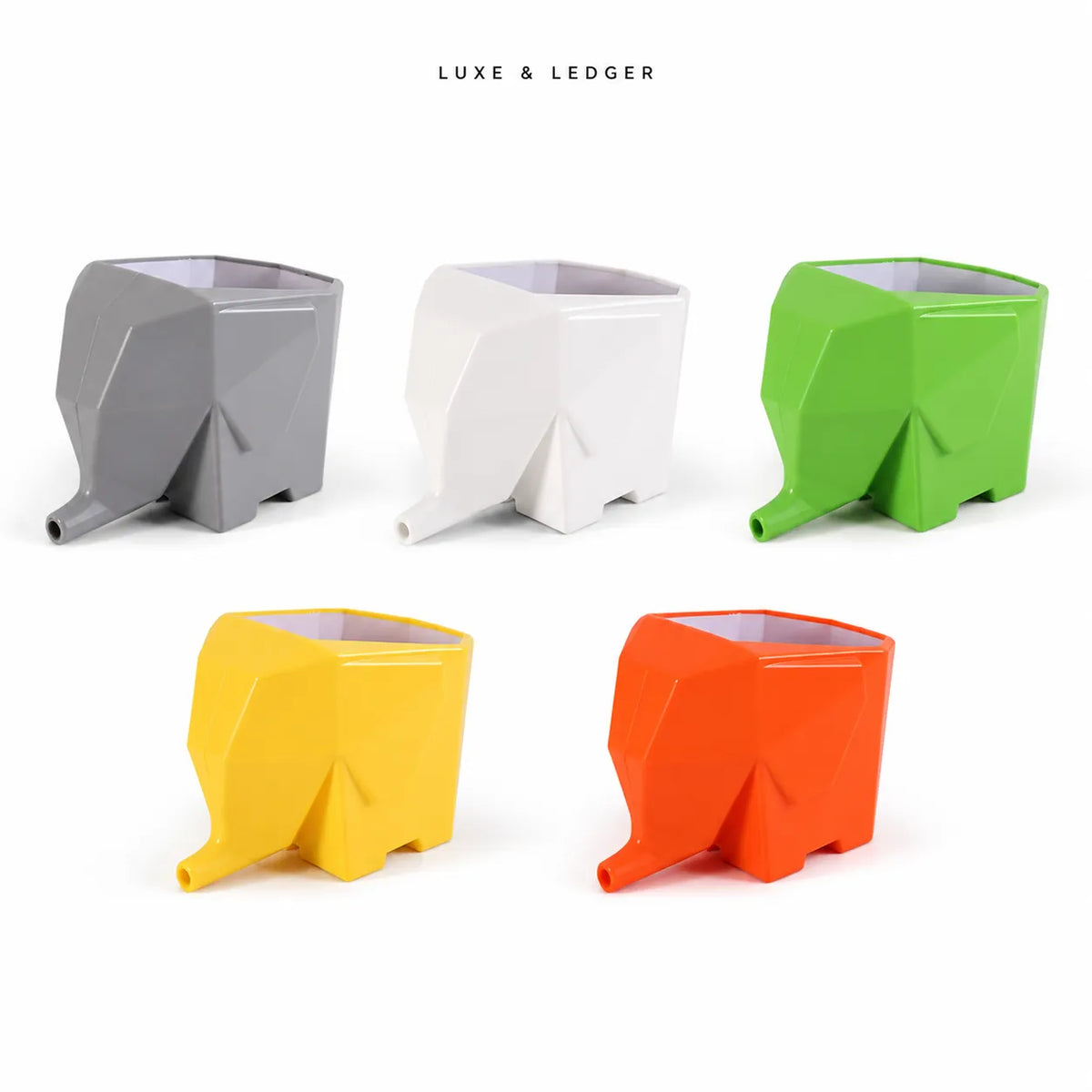 Five geometric elephant-shaped containers in gray, white, green, yellow, and orange, arranged on a white background with the text 'LUXE & LEDGER' above them.