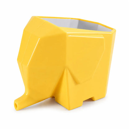 A bright yellow geometric elephant-shaped planter with a faceted, modern design and an open top, shown on a clean white background.